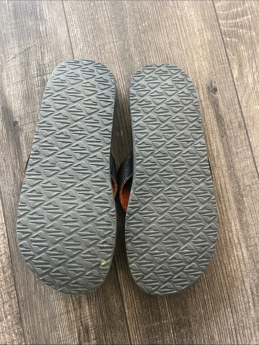 Reef Roundhouse Flip Flops in orange and black